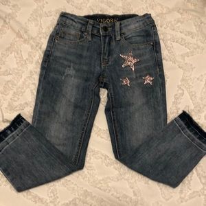 Distressed jeans with pink stars